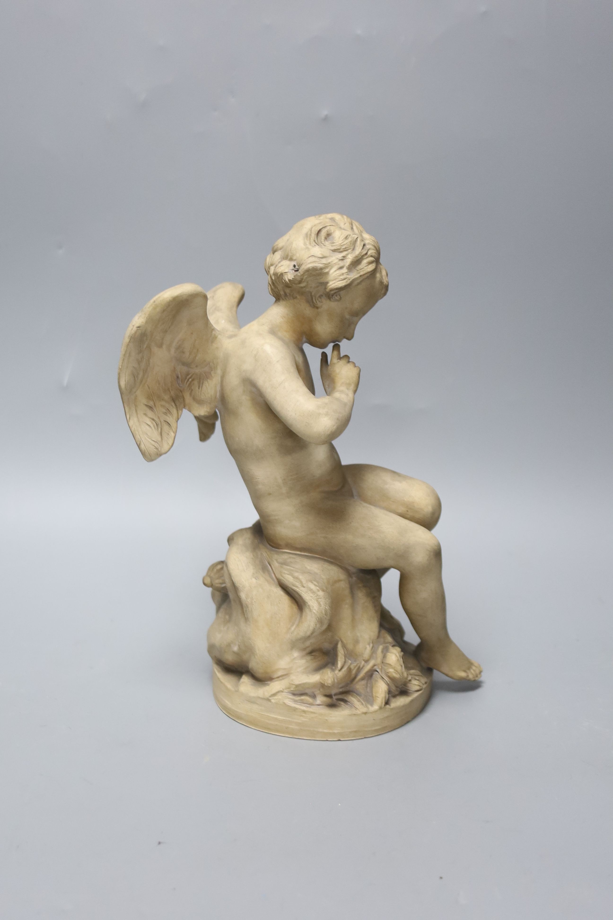 A Sevres style terracotta figure of Cupid, 25cm